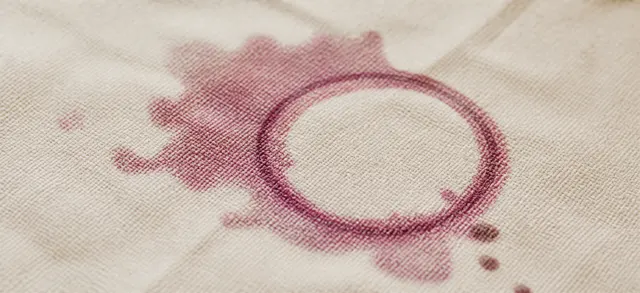 Red wine ring on woven cotton