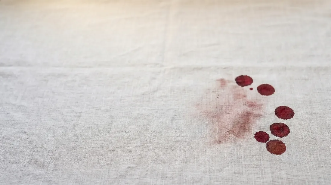 Dried blood drops and a smear on linen